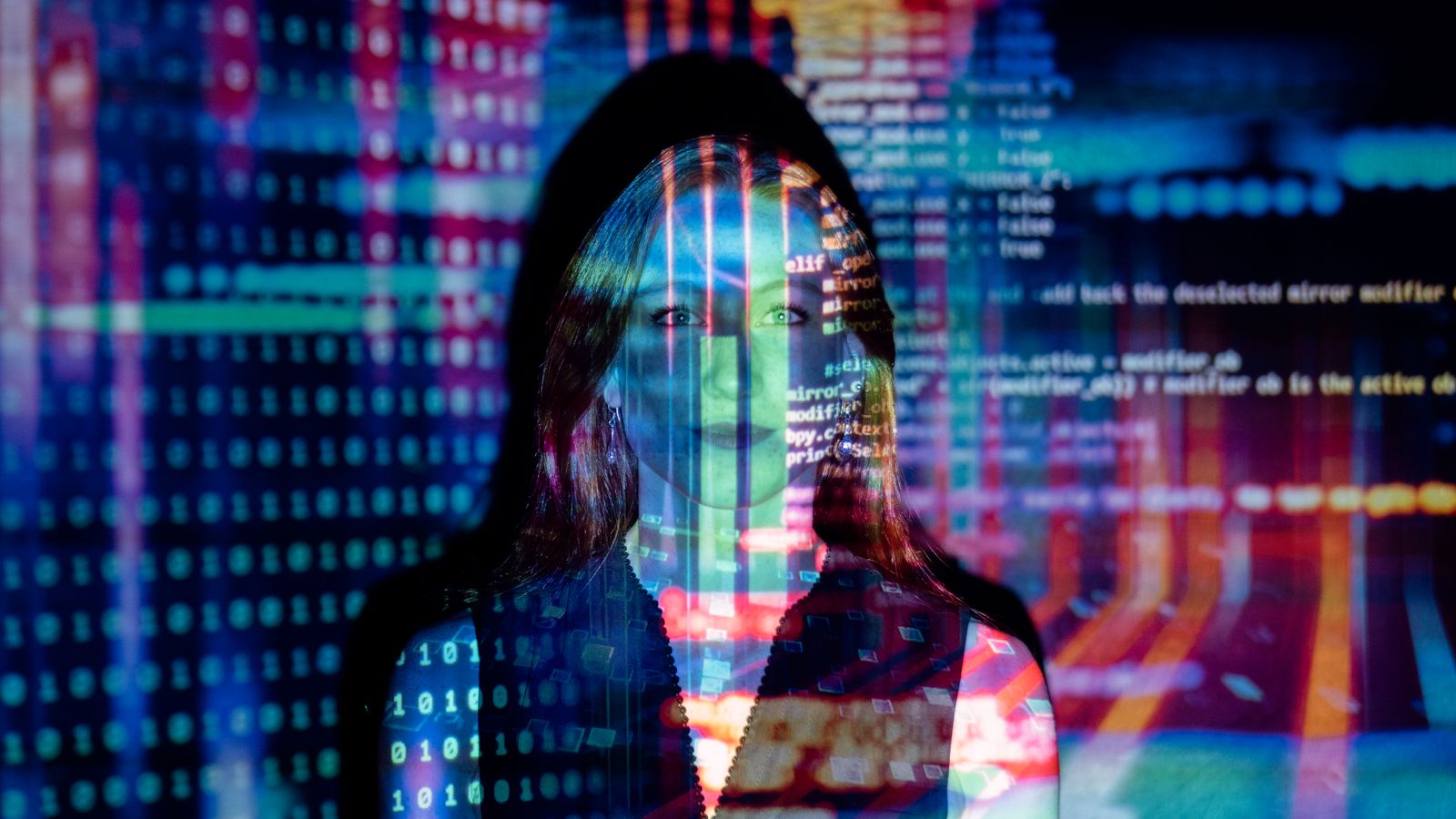 Code projected over a person working, representing Claude Code running autonomously