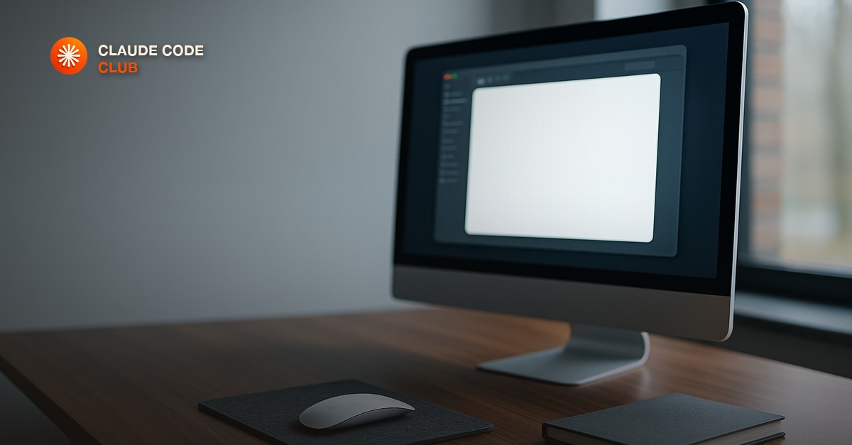 A desktop monitor on a clean walnut desk showing a blank glowing application window, a wireless mouse resting on a grey felt pad and a closed notebook beside it, cool morning light from a side window