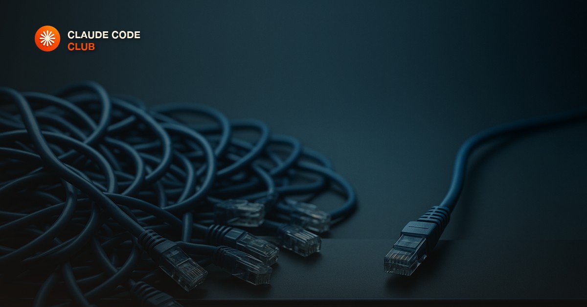 A tangle of unplugged network patch cables beside one neatly seated connector on a matte grey rack panel