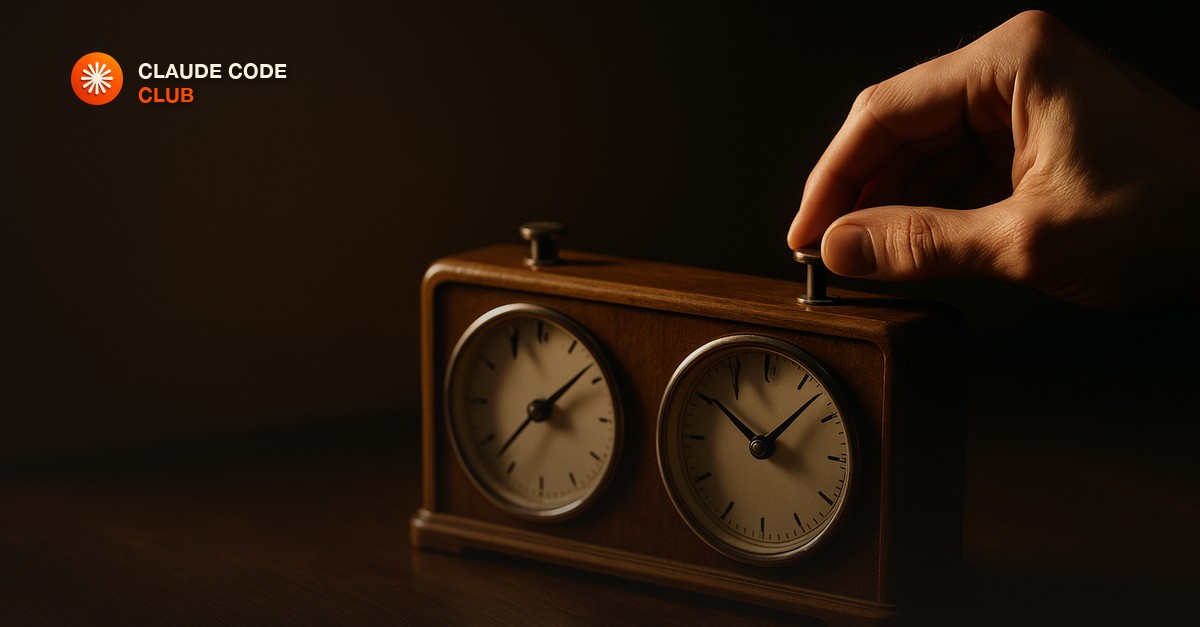 Two vintage chess clocks side by side on a dark wooden desk under warm side light, a hand mid-press on one plunger