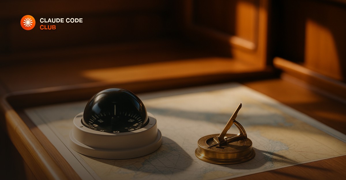 A sailboat and a compass sitting on a chart table, one pointed toward an open editor window and one toward an open terminal