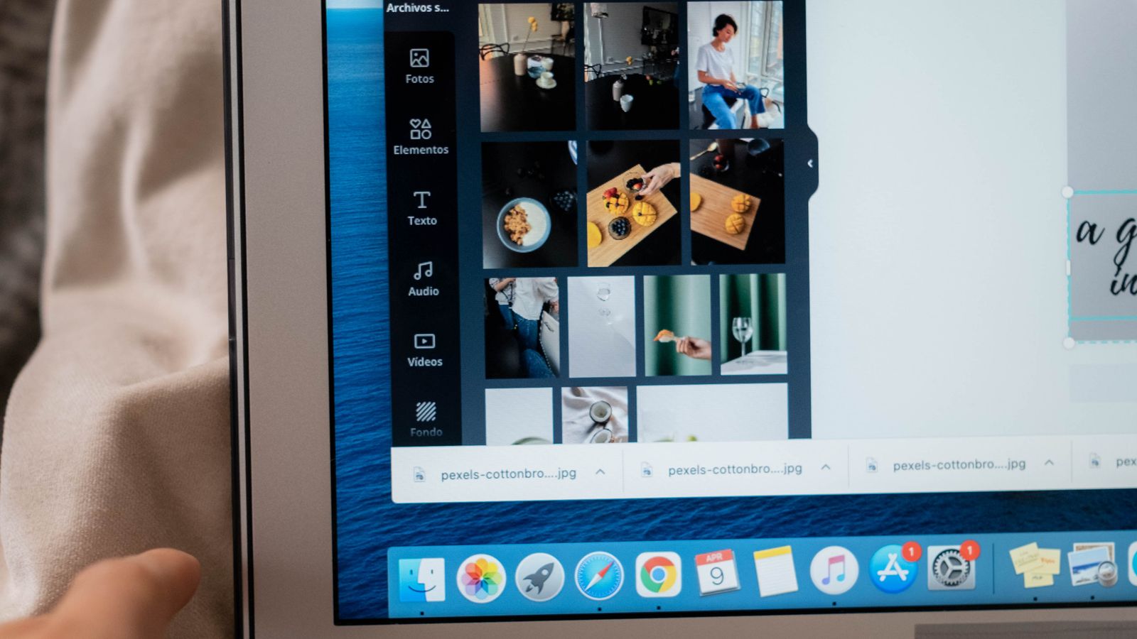 A laptop screen showing a design app with a grid of photo thumbnails.