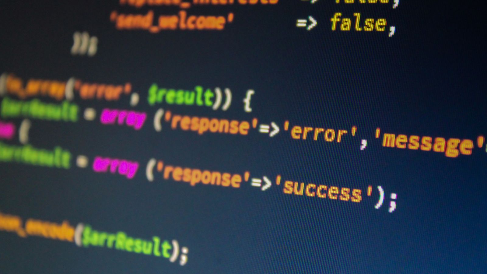 A close-up of a screen showing colorful code with error and success values.