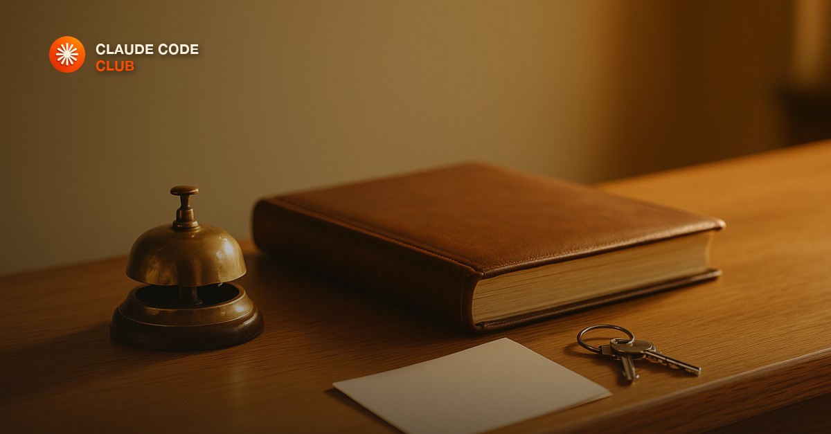 A brass desk bell, a closed leather-bound ledger, a ring of keys and a blank card on a warm oak counter in golden late-afternoon light