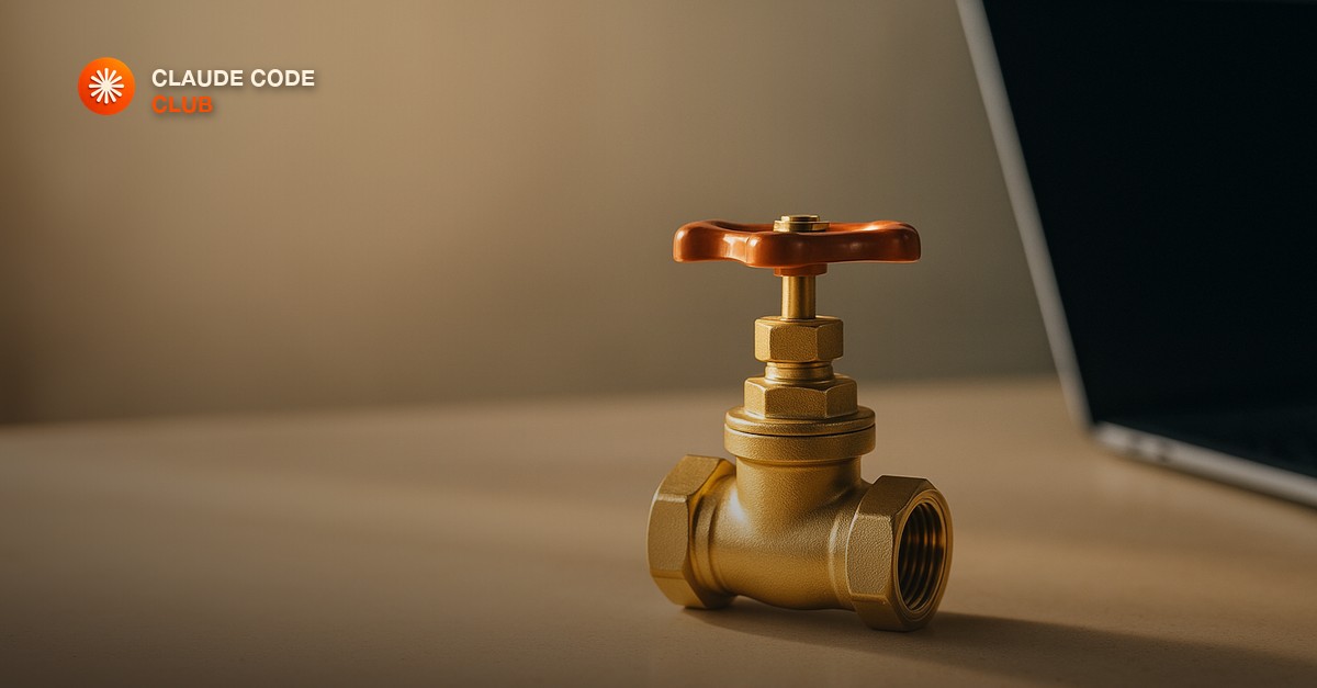 A single polished brass pipeline valve on a clean workshop bench beside a closed laptop in warm morning light
