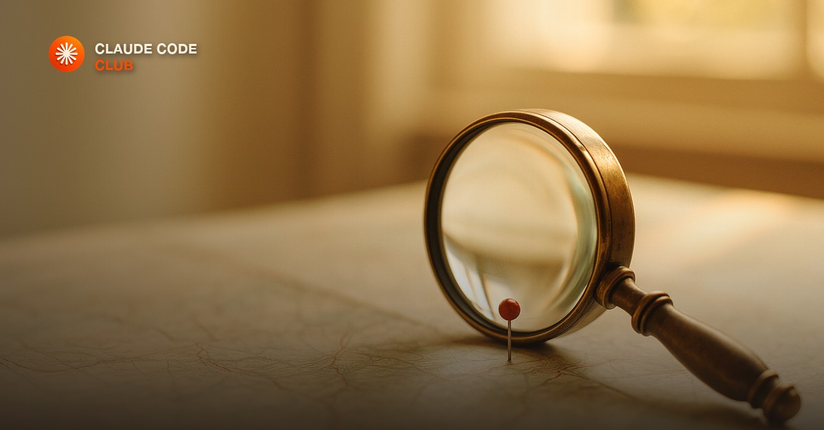 A brass magnifying glass on an open map with a single red pin marking one chosen spot in warm daylight