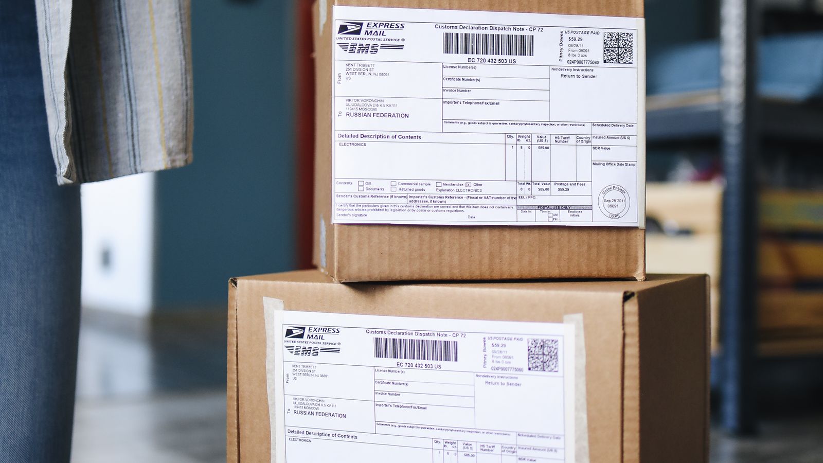 Two stacked cardboard shipping boxes with labels, representing a productized service