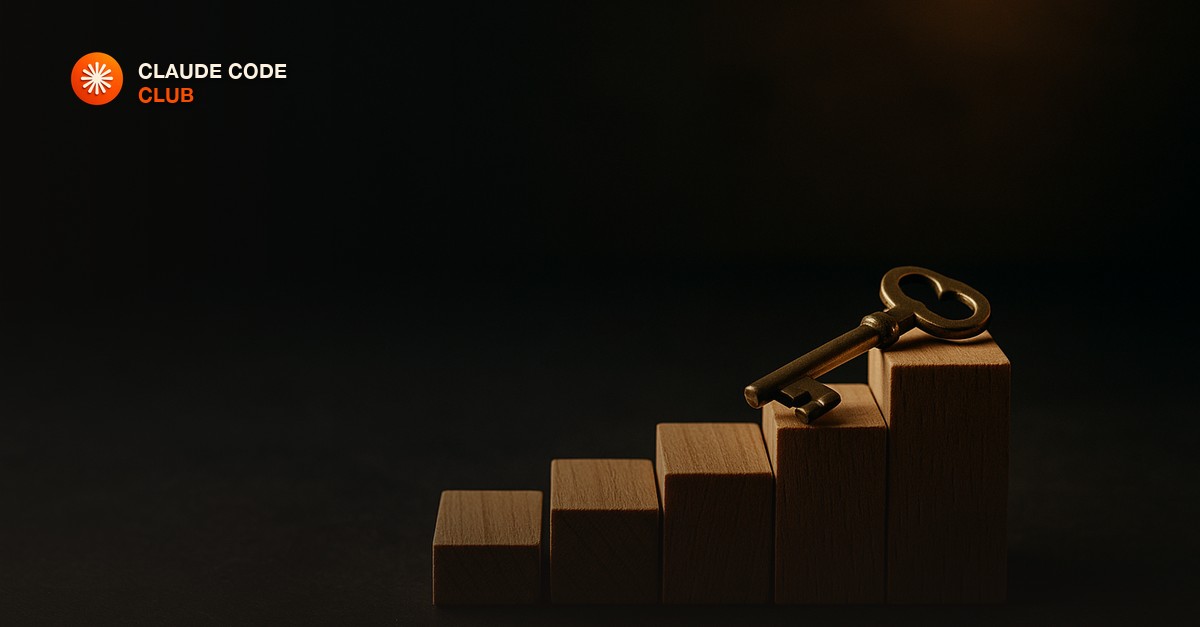 Five small wooden blocks arranged like ascending steps on a dark slate desk, with a brass key resting on the top block, in moody low lamp light