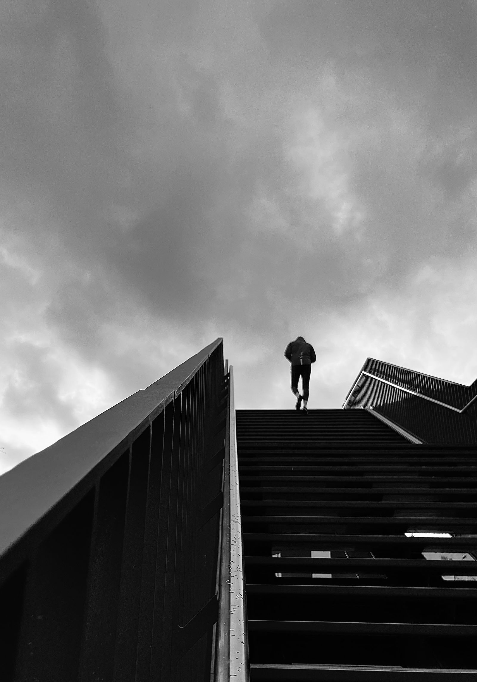 A wide staircase climbing upward, shot from below